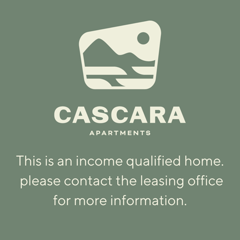 A sign for Cascara Apartments indicating it is an income qualified home and directing to contact the leasing office for more information.